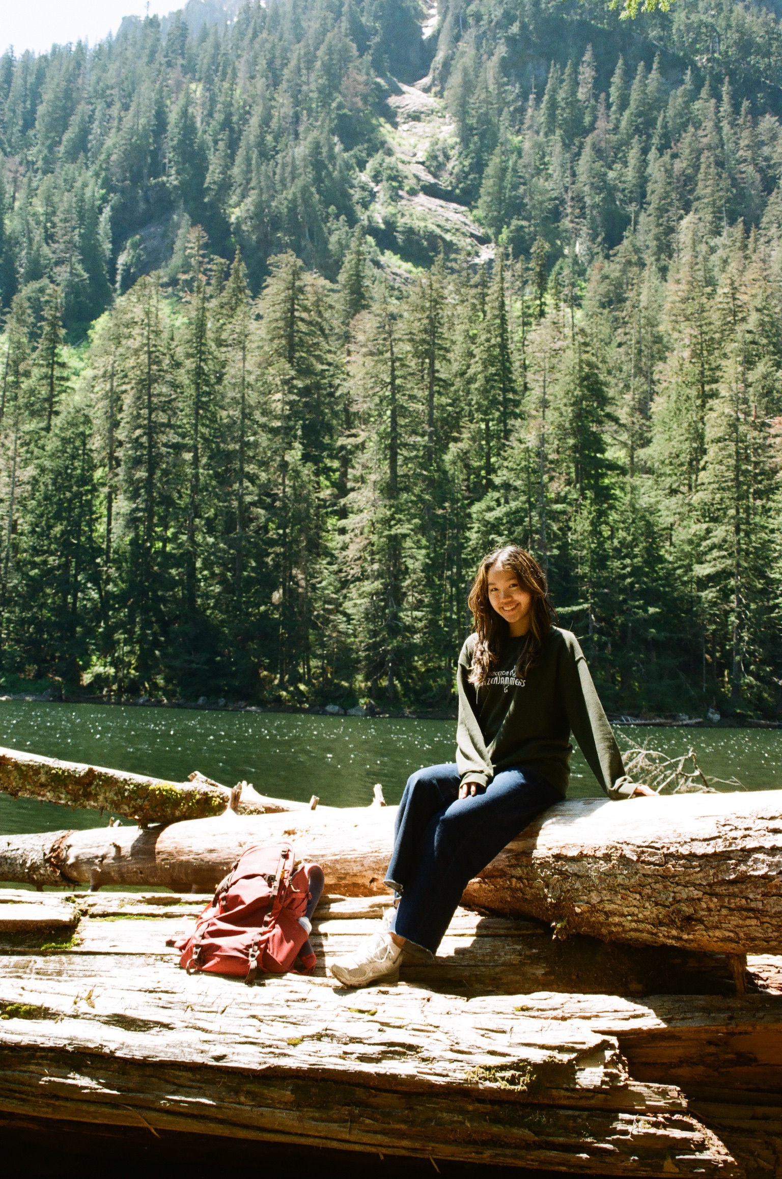 At an alpine lake in a Katzenjammers sweatshirt