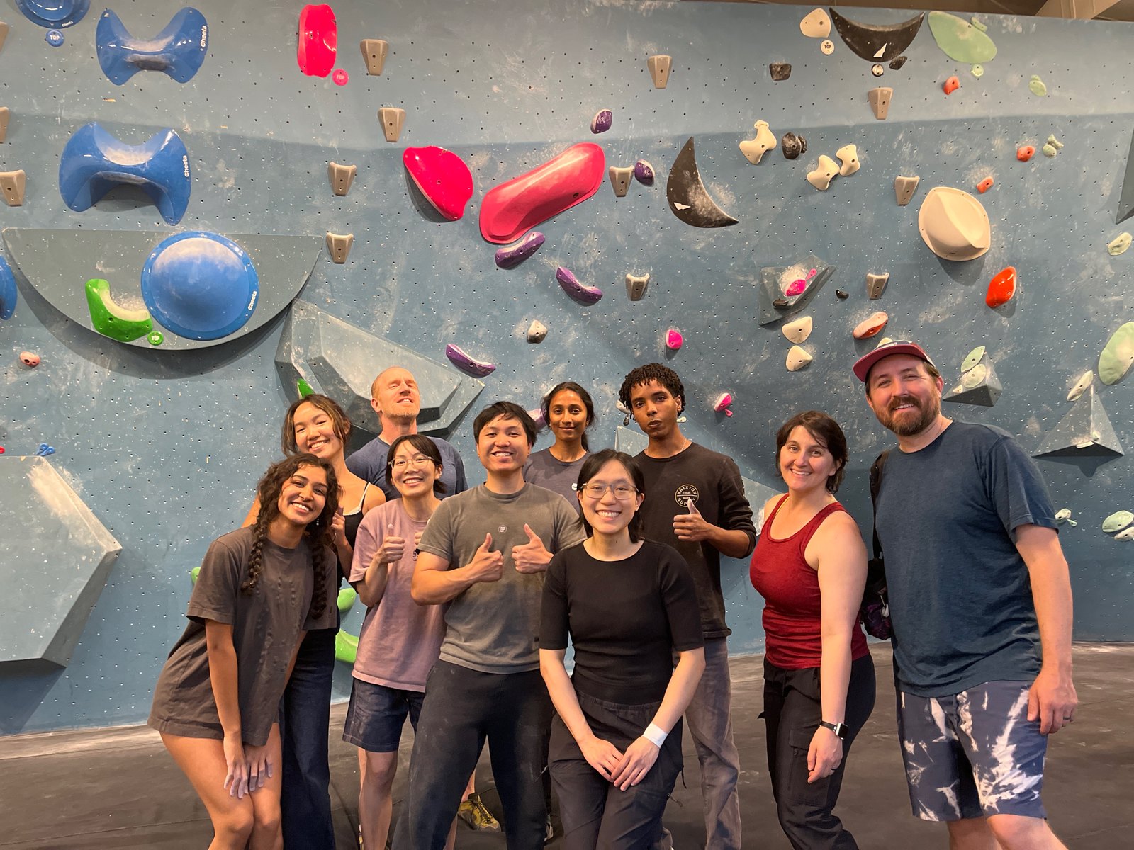 Chloe and the summer intern cohort at a climbing gym